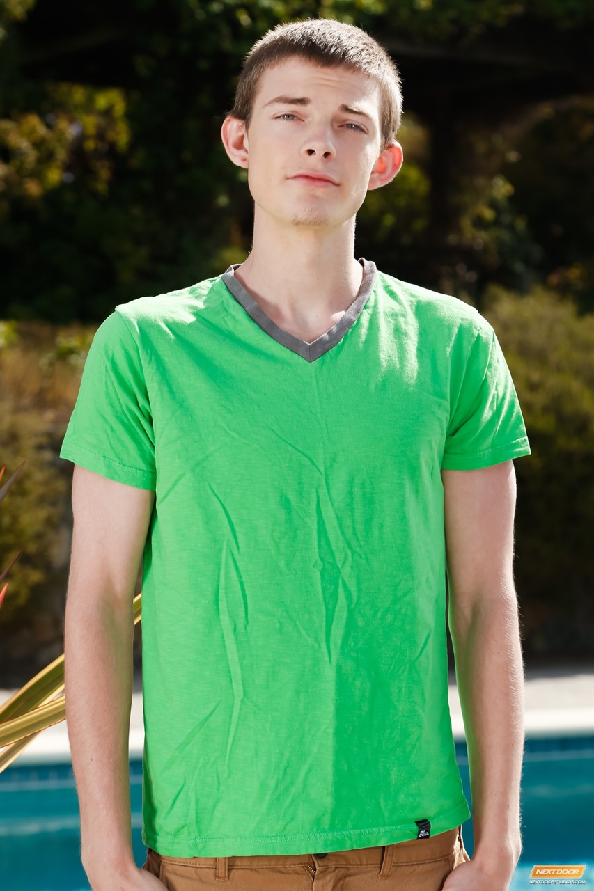 Skinny gay Tyson Stone doffs his clothes slowly and poses poolside
