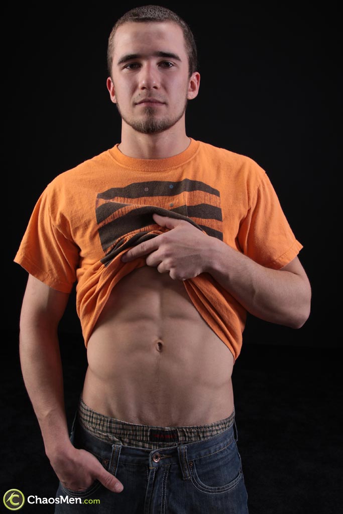 Sexy gay model Heath exposing his six pack and a rock hard dick