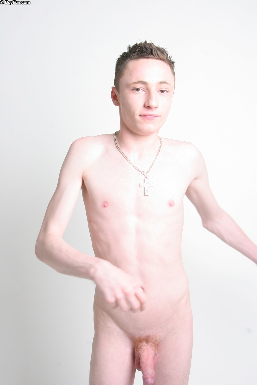 Sexy Caucasian gay boy Ryan Lancaster strips naked & tugs his big uncut dick  