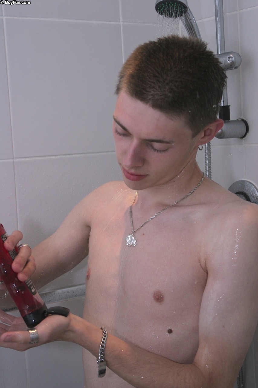 Skinny gay Craig Baxter jerks his uncut dick to ejaculation in the shower