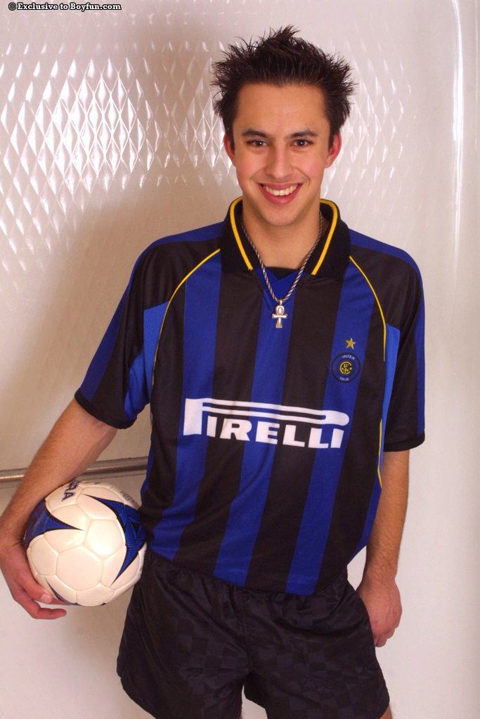 Horny gay Kris doffs his Inter jersey and masturbates hard in a solo