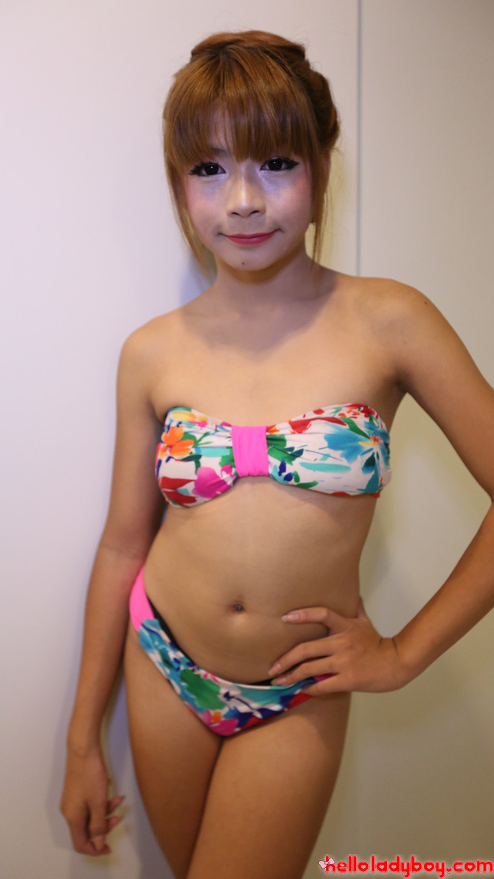 Pretty Asian shemale shows her petite body  