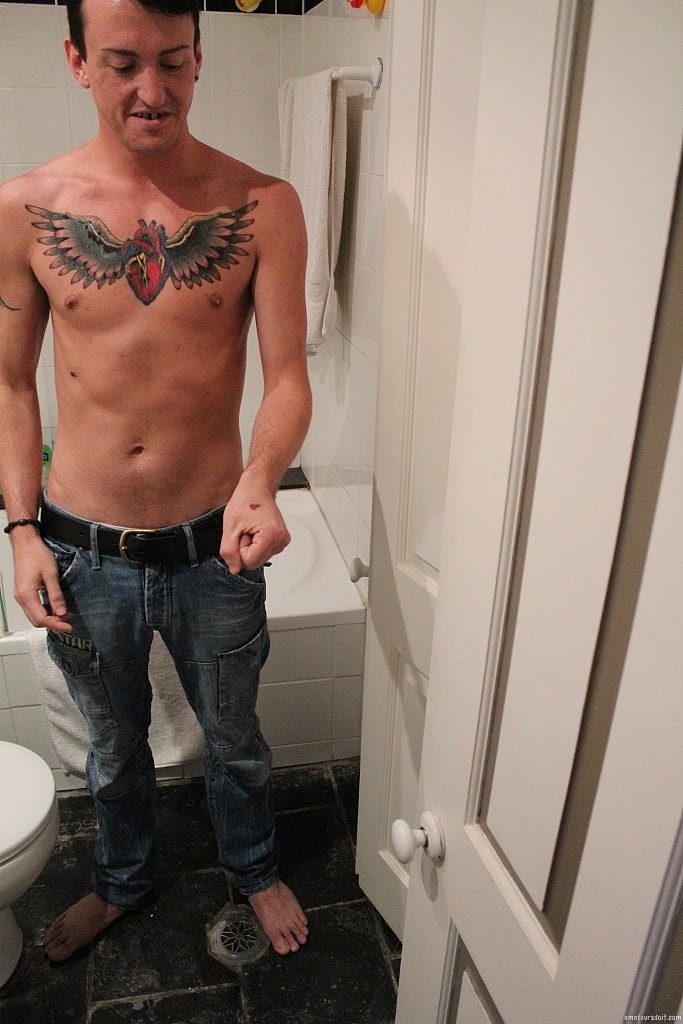 Sexy inked gay amateur Blaze Glory masturbates his big cock in the bathroom  