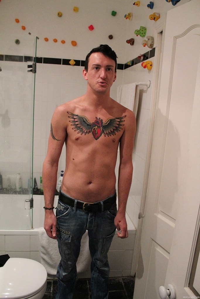 Sexy inked gay amateur Blaze Glory masturbates his big cock in the bathroom  